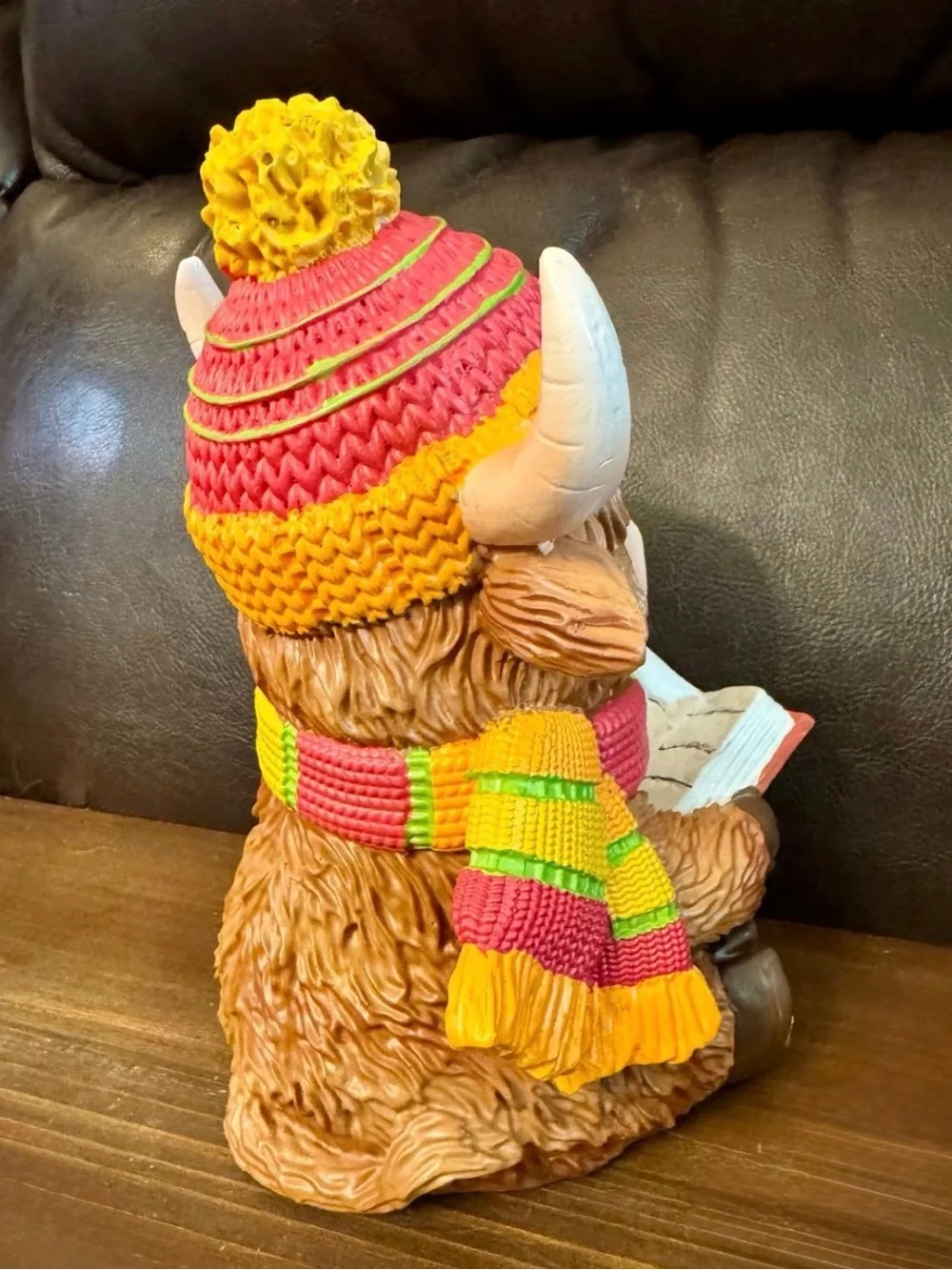 Brown Highland Cow Figurine with Yellow-Pink Knit Hat and Scarf